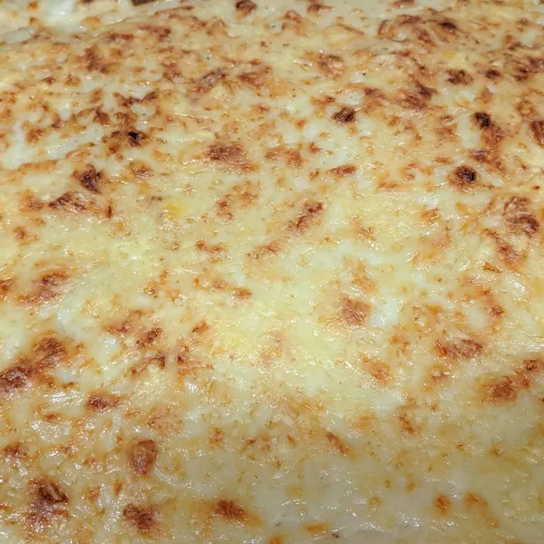 Lasaña de espinacas y champiñones con jamón y bacon
